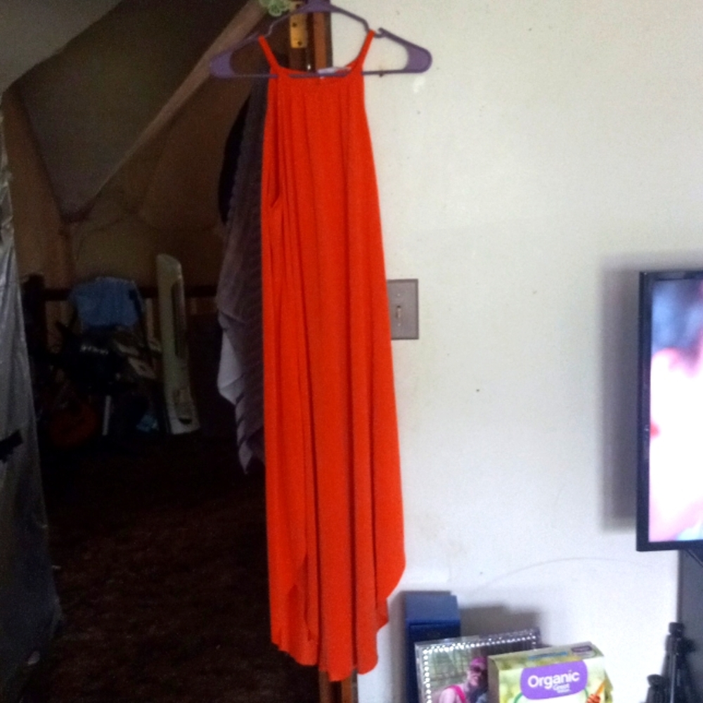 Orange sleeveless soft silky dress.